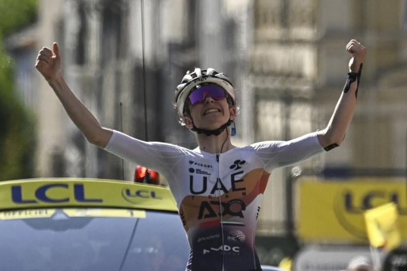 UAE Team ADQ's French rider Maeva Squiban celebrates as she crosses the finish line to win the 6th stage (out of 9) of the fourth edition of the Women's Tour de France cycling race, 123.7 km from Clermont-Ferrand to Ambert, in Ambert, central France on July 31, 2025.  JULIEN DE ROSA / AFP