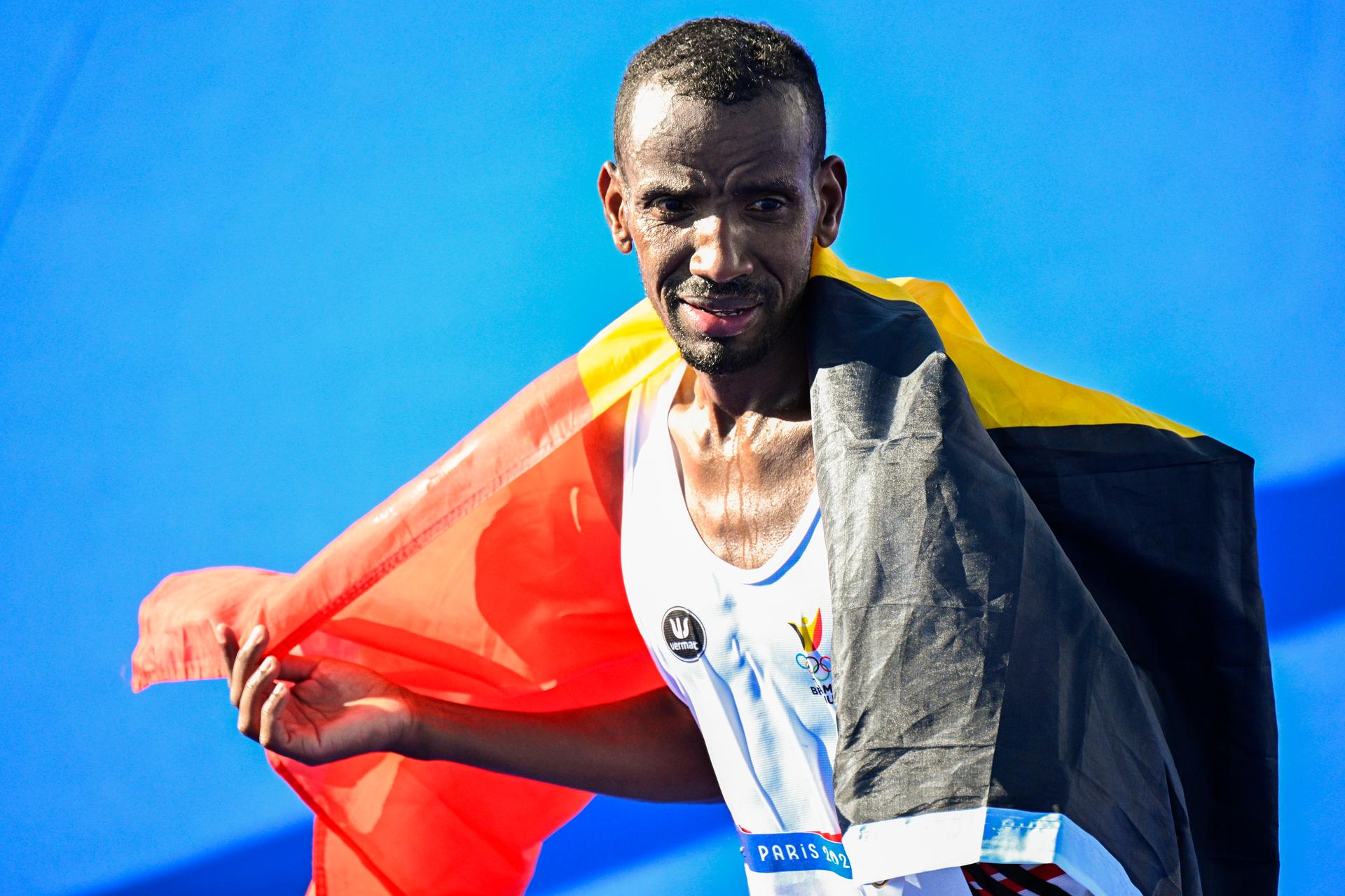 Belgian athlete Bashir Abdi celebrates as he crosses the finish line to win the silver medal of the men's marathon of the athletics competition at the Paris 2024 Olympic Games, on Saturday 10 August 2024 in Paris, France. The Games of the XXXIII Olympiad are taking place in Paris from 26 July to 11 August. The Belgian delegation counts 165 athletes competing in 21 sports. BELGA PHOTO JASPER JACOBS
