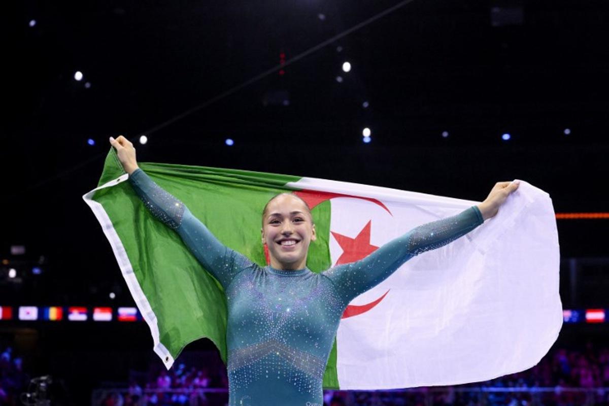 Algeria's Kaylia Nemour reacts after winning the Women's Balance Beam Final during the 54th FIG Artistic Gymnastics World Championships, in Rotterdam, southern Netherlands, on October 25, 2026.  JOHN THYS / AFP