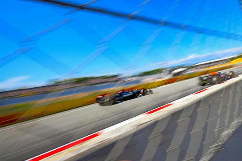 Mercedes' British driver George Russell and Red Bull's Mexican driver Sergio Perez (R) take part in the second practice session at the Circuit de Catalunya on June 21, 2024 in Montmelo, on the outskirts of Barcelona, ahead of the Spanish Formula One Grand Prix.   Josep LAGO / AFP