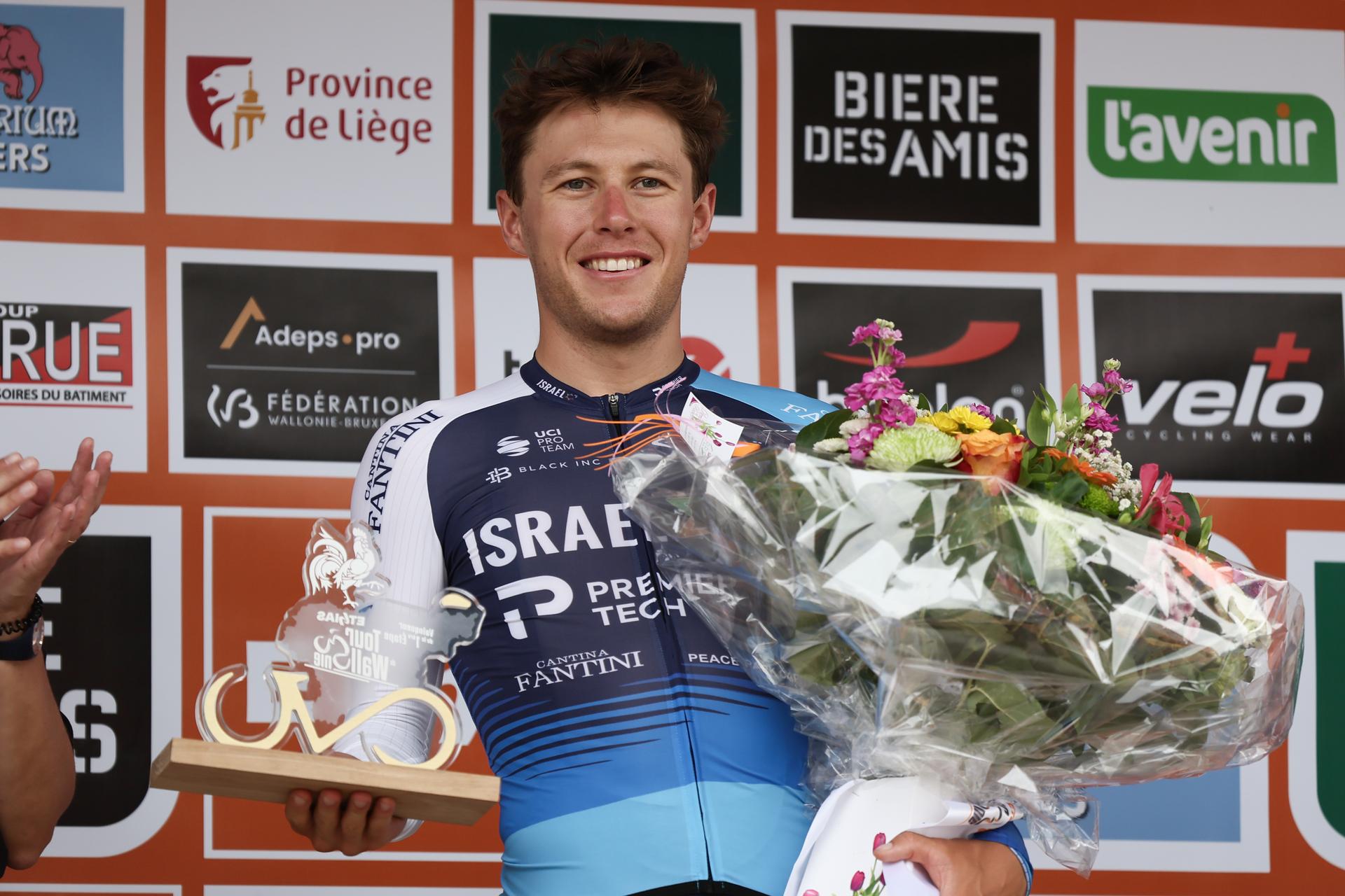 New Zealander Corbin John Strong of Israel-Premier Tech celebrates on the podium after winning the first stage of the Tour De Wallonie cycling race, from and back to Nassogne (182 km)on, Saturday 26 July 2025. BELGA PHOTO BRUNO FAHY