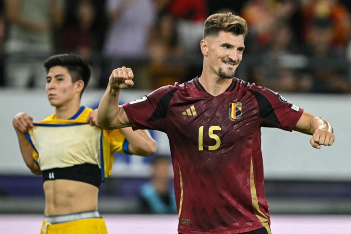 Belgium's defender #15 Thomas Meunier celebrates after scoring his team's sixth goal during the FIFA World cup 2026 1st round day 6, Group J qualification football match between Belgium and Kazakhstan, at the Lotto Park stadium in Anderlecht, Brussels Capital Region, on September 7, 2025.  NICOLAS TUCAT / AFP