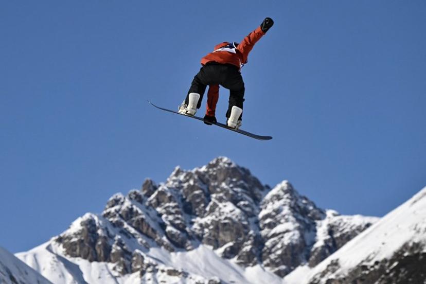 Belgium's Evy Poppe competes in the snowboard women's slopestyle qualification run 1 during the Milano Cortina 2026 Winter Olympic Games at Livigno Snow Park, in Livigno (Valtellina), on February 15, 2026.  Jeff PACHOUD / AFP
