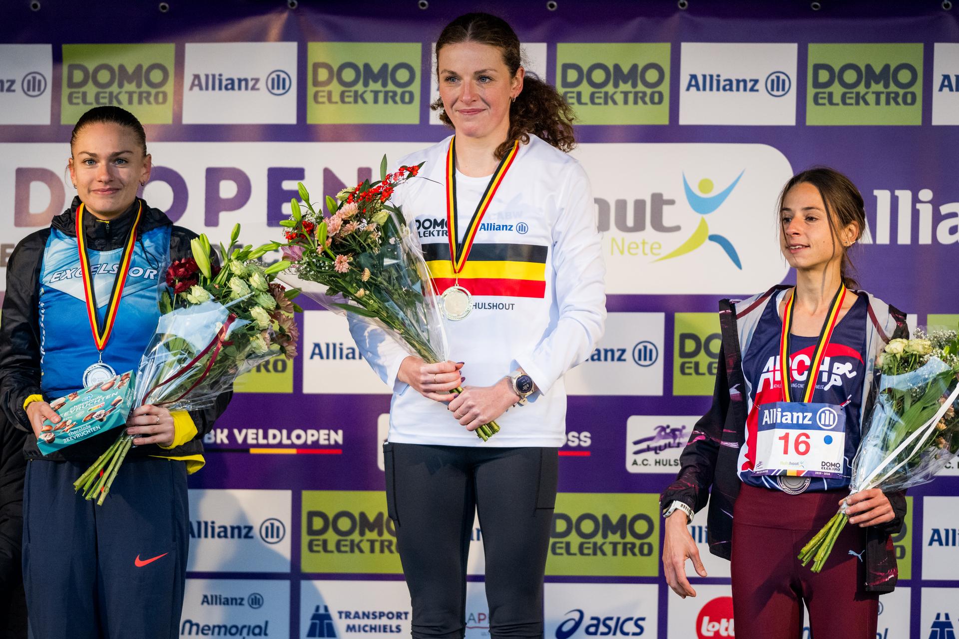 Belgian Jana Van Lent, Belgian Lisa Rooms and Belgian Chloe Herbiet pictured on the podium after the women's race at the Belgian championships cross country running, in Hulshout, Sunday 30 November 2025. BELGA PHOTO JASPER JACOBS