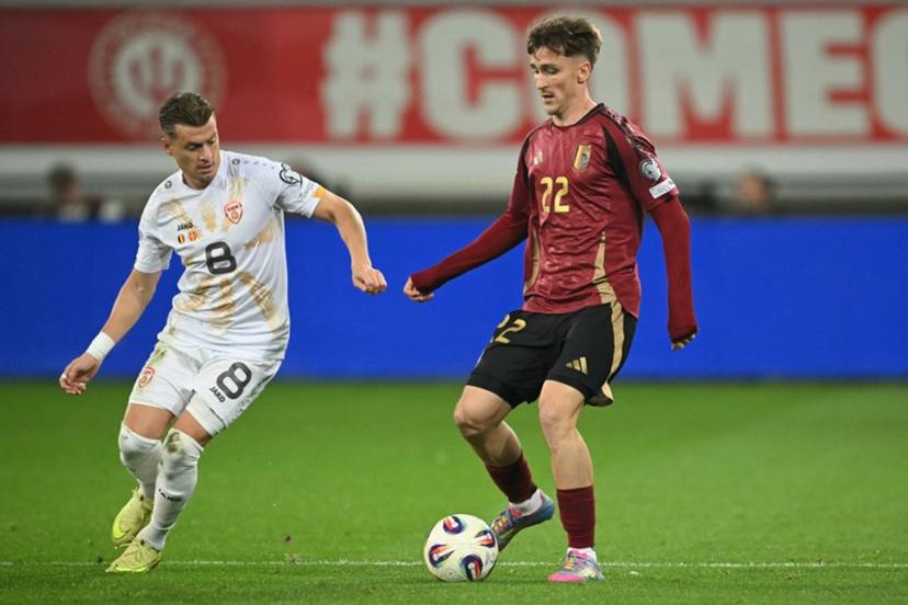 North Macedonia 's defender #08 Ezgjan Alioski (L) fights for the ball with Belgium's midfielder #22 Alexis Saelemaekers during the FIFA World Cup 2026 Group J European qualification football match between Belgium and North Macedonia at the Planet Group Arena in Ghent, on October 10, 2025. NICOLAS TUCAT / AFP