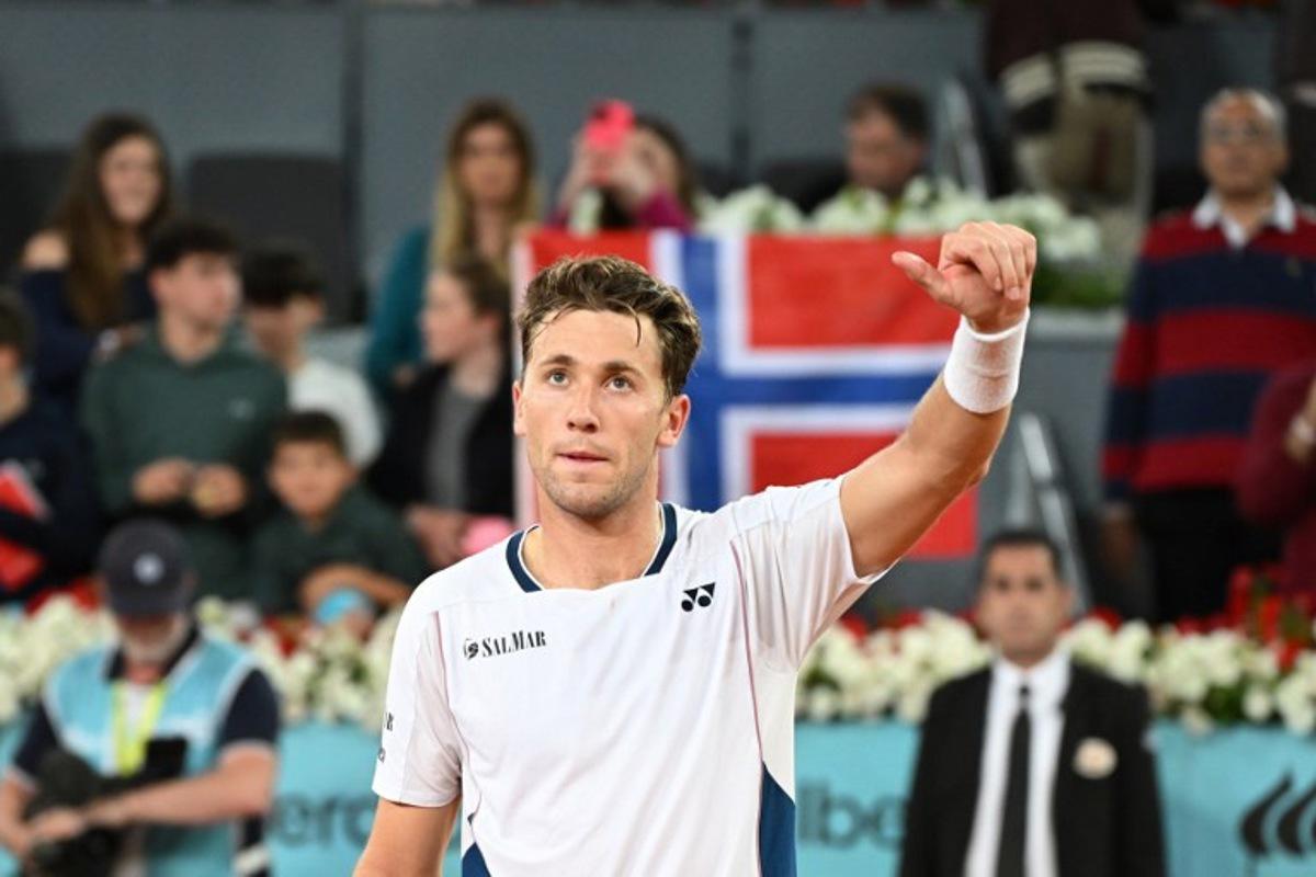 Norway's Casper Ruud celebrates after winning to Argentina's Francisco Cerundolo during their 2025 ATP Tour Madrid Open tennis tournament semi-final singles match at the Caja Magica in Madrid, on May 2, 2025. JAVIER SORIANO / AFP