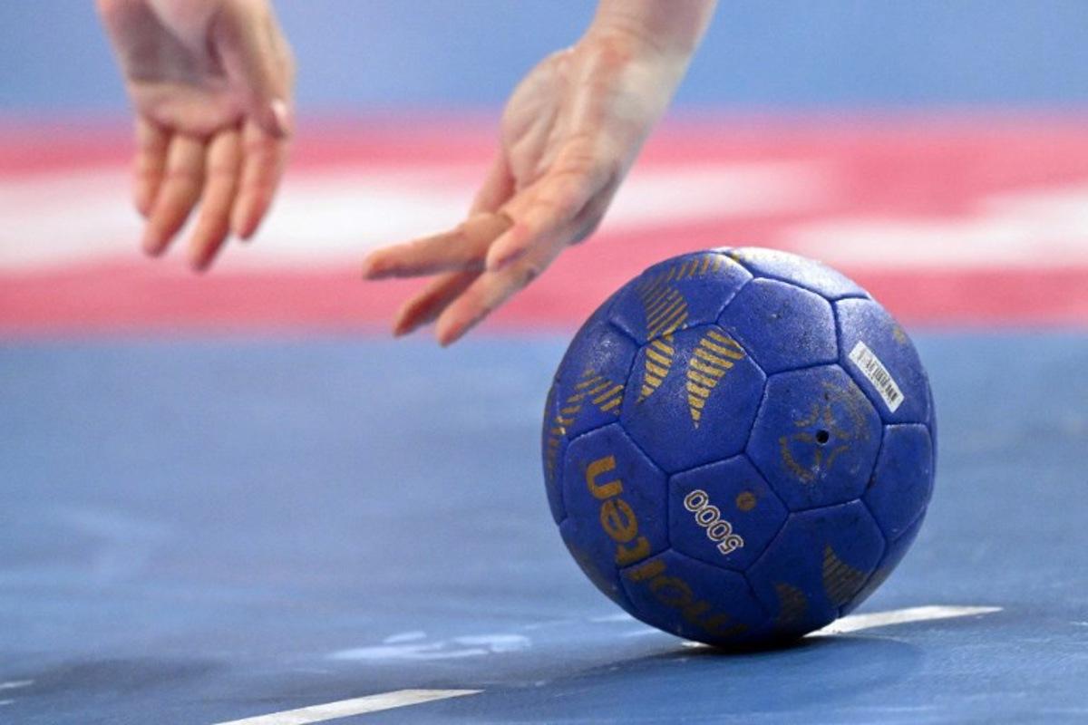 Germany's pivot #09 Lisa Carolin Antl in action during the women's Handball Olympic qualifying match between Paraguay and Germany in Neu-Ulm, southern Germany on April 14, 2024. Kirill KUDRYAVTSEV / AFP