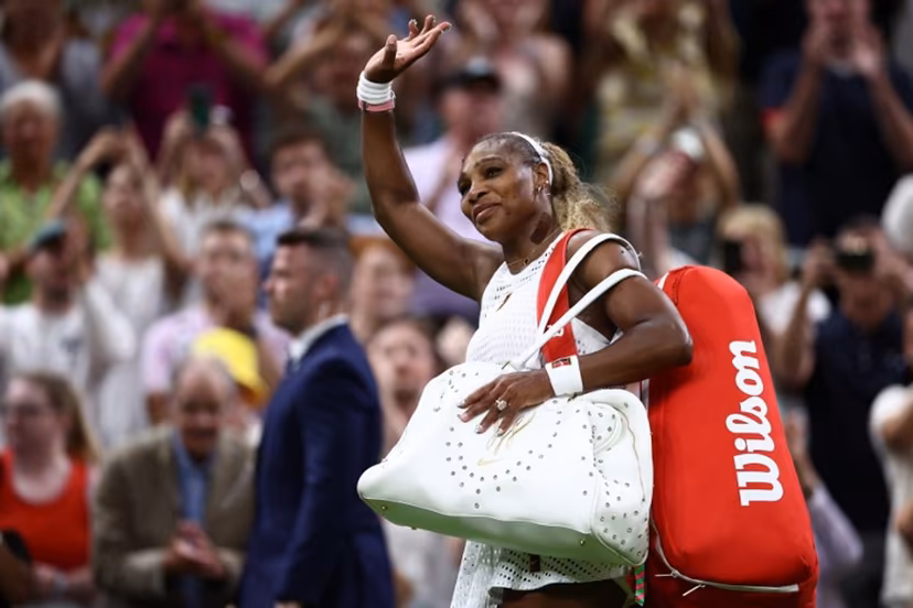 US player Serena Williams waves as he leaves the court after being defeated by Australia's Maya Joint during their women's singles first round tennis match on the second day of the 2026 Wimbledon Championships at The All England Lawn Tennis and Croquet Club in Wimbledon, southwest London, on June 30, 2026. Henry NICHOLLS / AFP