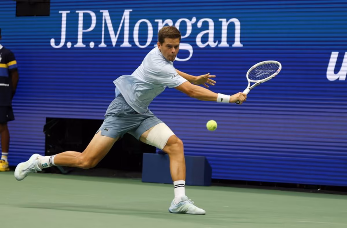 Belgium's Alexander Blockx returns the ball to Russia's Karen Khachanov during the men's singles quarter-final tennis match on day eleven of the US Open tennis tournament at the USTA Billie Jean King National Tennis Center in New York City on September 9, 2026. TIMOTHY A. CLARY / AFP