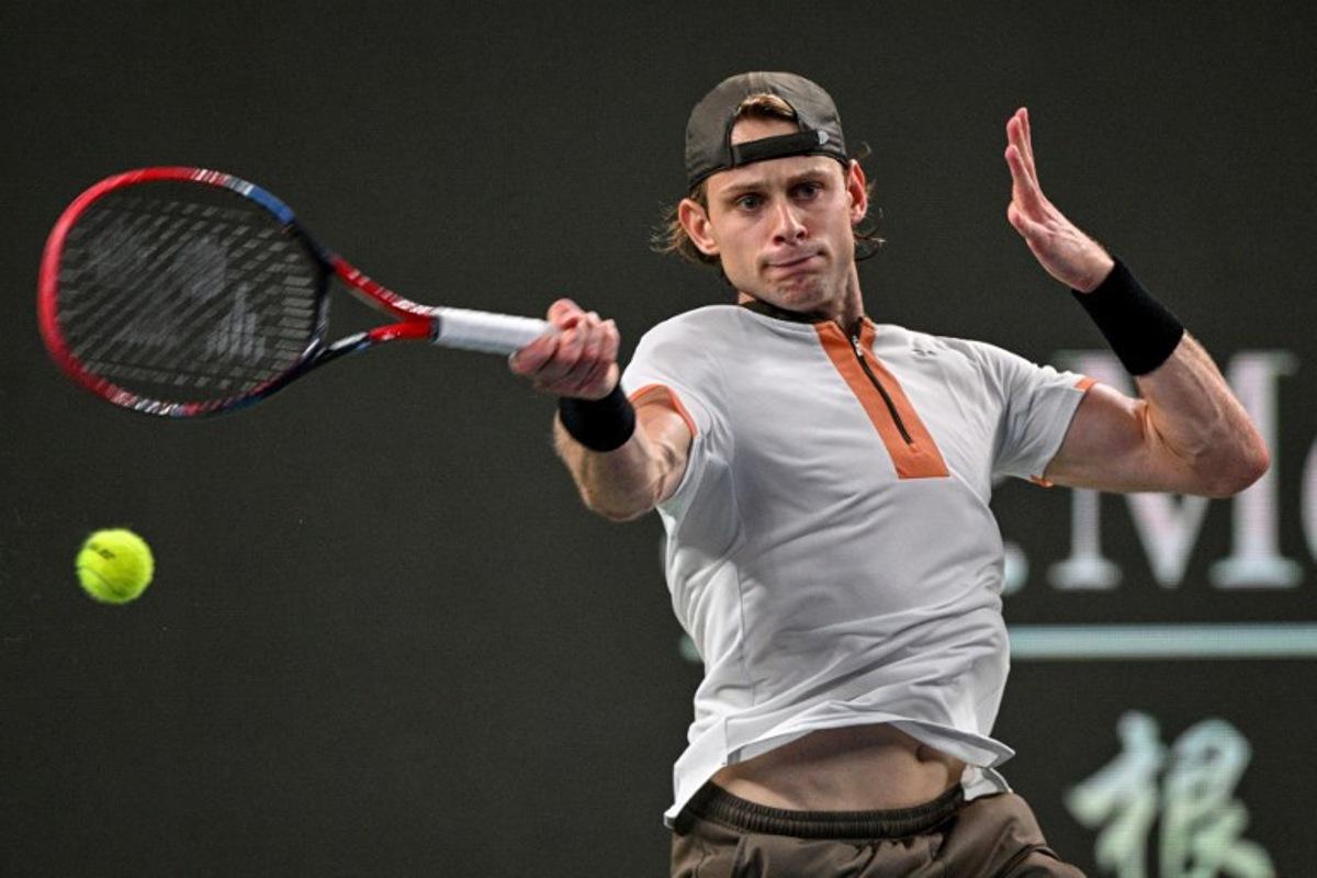 Belgium's Zizou Bergs hits a return to Serbia's Novak Djokovic during their quarter-final men's singles match at the Shanghai Masters tennis tournament in Shanghai on October 9, 2025. Hector RETAMAL / AFP