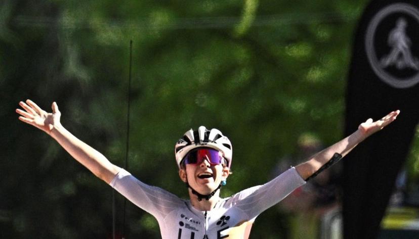 UAE Team ADQ's French rider Maeva Squiban celebrates as she crosses the finish line to win the 7th stage (out of 9) of the fourth edition of the Women's Tour de France cycling race, 159.7 km from Bourg-en-Bresse to Chambéry, in Chambéry, south-eastern France on August 1, 2025. JULIEN DE ROSA / AFP