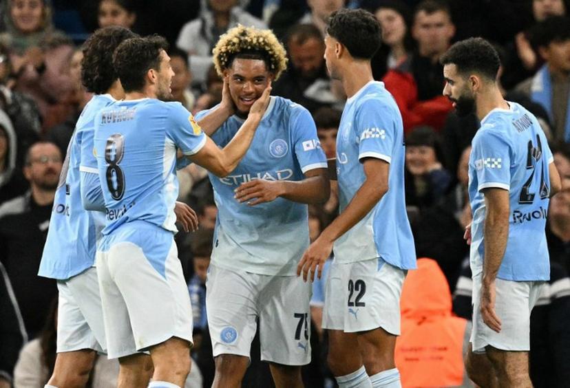 Manchester City's French midfielder #75 Floyd Samba (C) celebrates scoring the opening goal during the English League Cup third round football match between Manchester City and Norwich City at the Etihad stadium in Manchester, northwest England on September 17, 2026. Oli SCARFF / AFP
