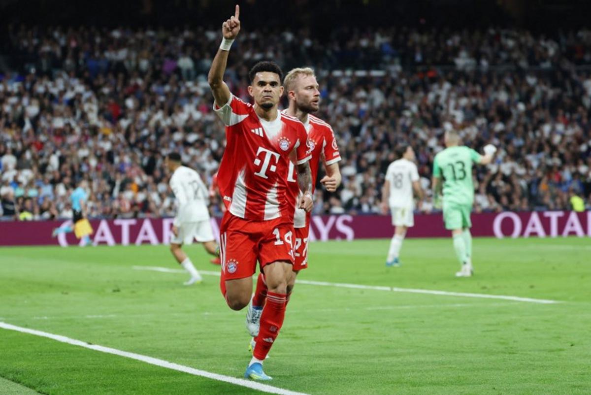 Bayern Munich's Colombian forward #14 Luis Diaz celebrates scoring the opening goal during the UEFA Champions League quarter final first leg football match between Real Madrid CF and FC Bayern Munich at Santiago Bernabeu Stadium in Madrid on April 7, 2026. Thomas COEX / AFP