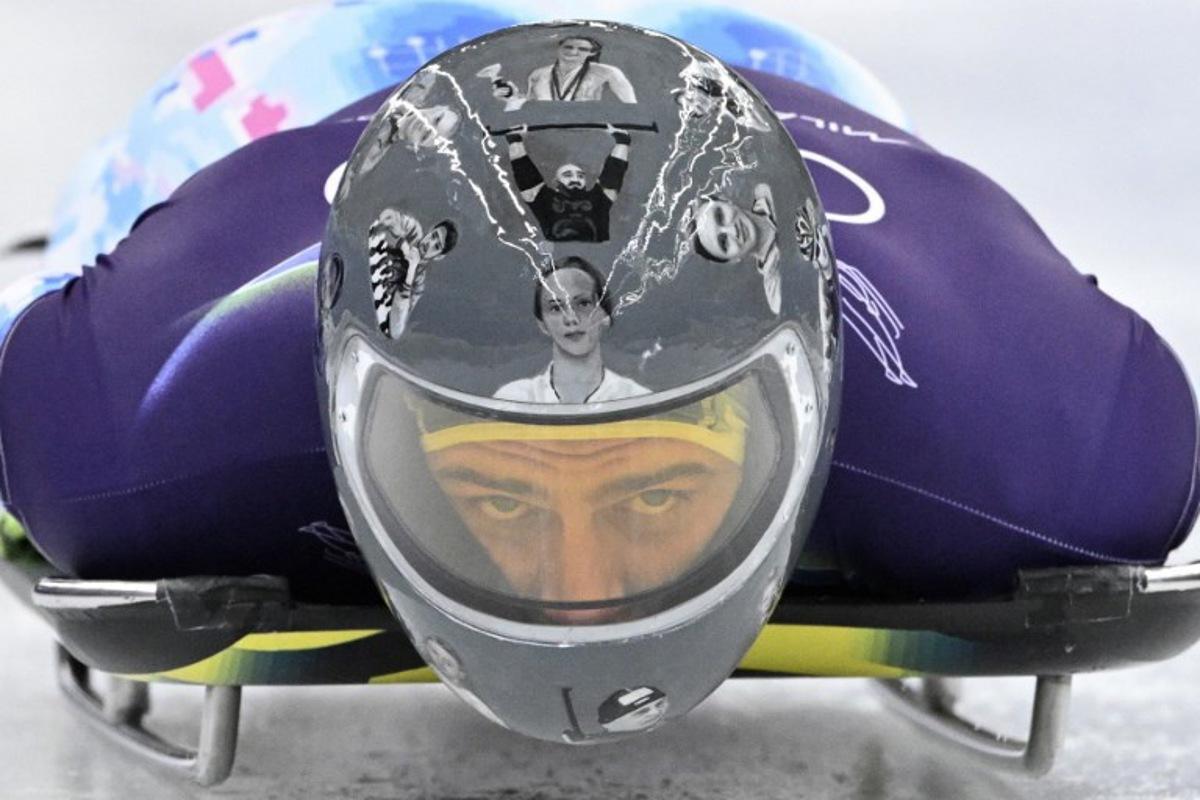 Ukraine's Vladyslav Heraskevych takes part in the skeleton men's training session at Cortina Sliding Centre during the Milano Cortina 2026 Winter Olympic Games in Cortina d'Ampezzo on February 11, 2026. Tiziana FABI / AFP