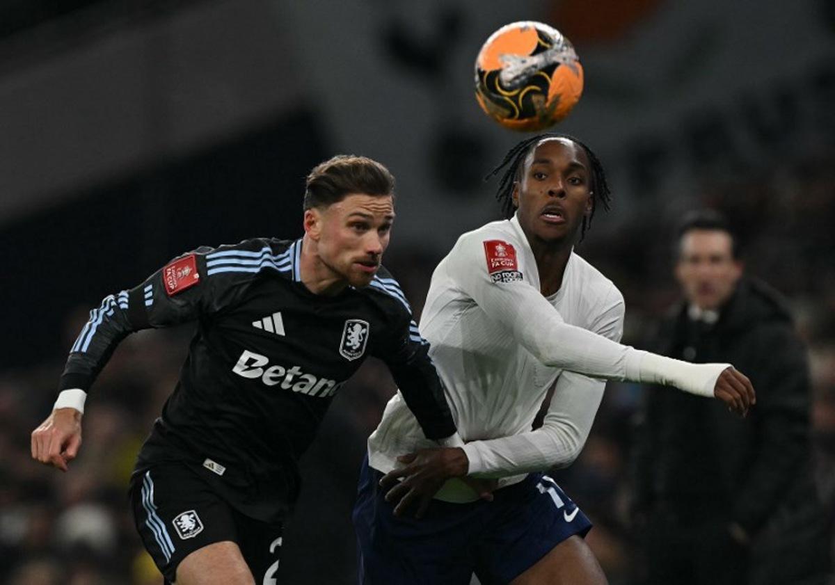 Aston Villa's Polish defender #02 Matty Cash (L) vies with Tottenham Hotspur's French midfielder #11 Mathys Tel during the English third round FA Cup football match between Tottenham Hotspur and Aston Villa at Tottenham Hotspur Stadium in London, on January 10, 2026. Glyn KIRK / AFP