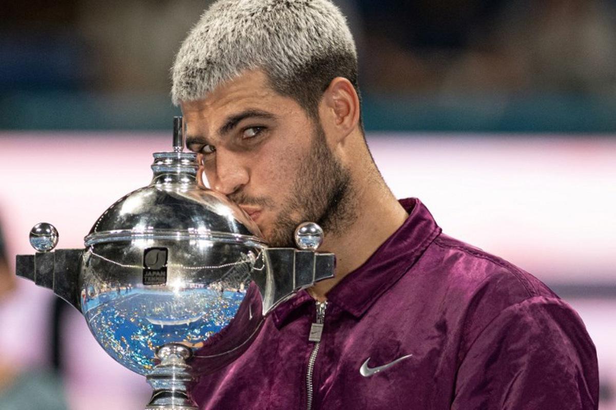 Spain's Carlos Alcaraz celebrates during the award ceremony after winning the men's singles final match against USA's Taylor Fritz at the ATP Japan Open tennis tournament in Tokyo on September 30, 2025. Philip FONG / AFP