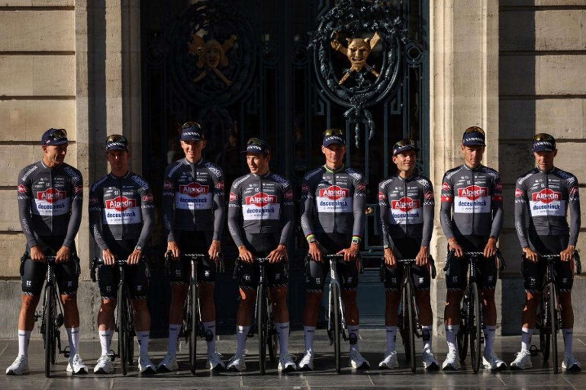 (From L) Alpecin - Deceuninck team's Belgian rider Jonas Rickaert, Alpecin - Deceuninck team's Australian rider Kaden Groves, Alpecin - Deceuninck team's Belgian rider Emiel Verstrynge, Alpecin - Deceuninck team's Belgian rider Jasper Philipsen, Alpecin - Deceuninck team's Dutch rider Mathieu van der Poel, Alpecin - Deceuninck team's Belgian rider Gianni Vermeersch, Alpecin - Deceuninck team's Swiss rider Silvan Dillier and Alpecin - Deceuninck team's Belgian rider Xandro Meurisse pose during the official teams presentation days prior to the start of the 112th edition of the Tour de France cycling race, in Lille, northern France, on July 3, 2025. Anne-Christine POUJOULAT / AFP