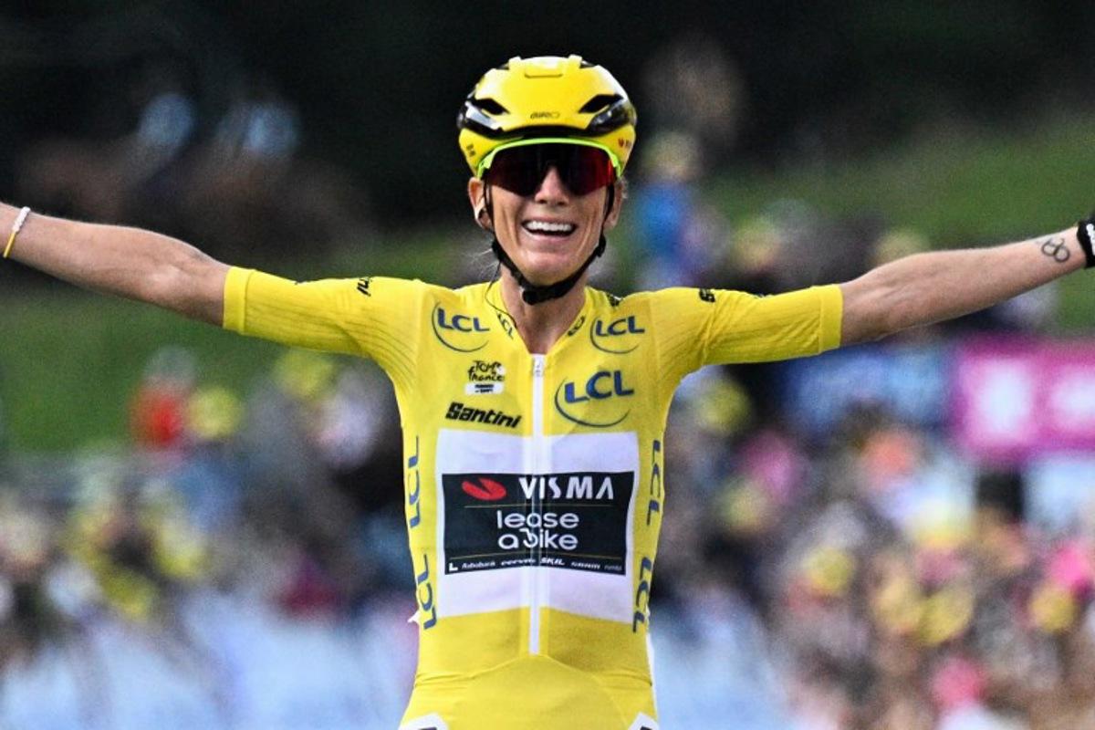 Overall leader's yellow jersey Team Visma | Lease a Bike's French rider Pauline Ferrand-Prevot celebrates as she crosses the finish line to win the 9th and final stage (out of 9) and the fourth edition of the Women's Tour de France cycling race, 124.1 km from Praz-sur-Arly to Chatel, in Chatel eastern France, on August 3, 2025. JULIEN DE ROSA / AFP