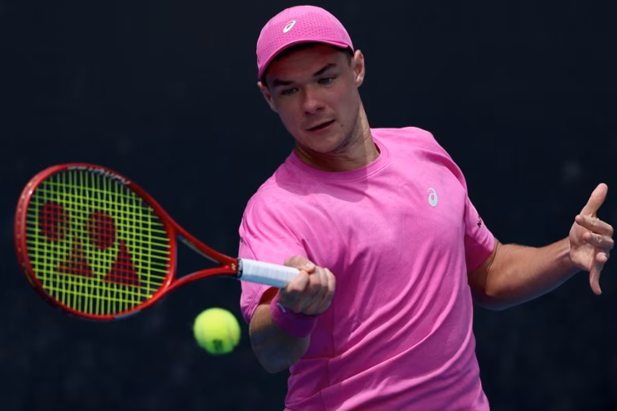 Poland's Kamil Majchrzak hits a return to Hungary's Fabian Marozsan during their men's singles match on day four of the Australian Open tennis tournament in Melbourne on January 21, 2026. Martin KEEP / AFP
