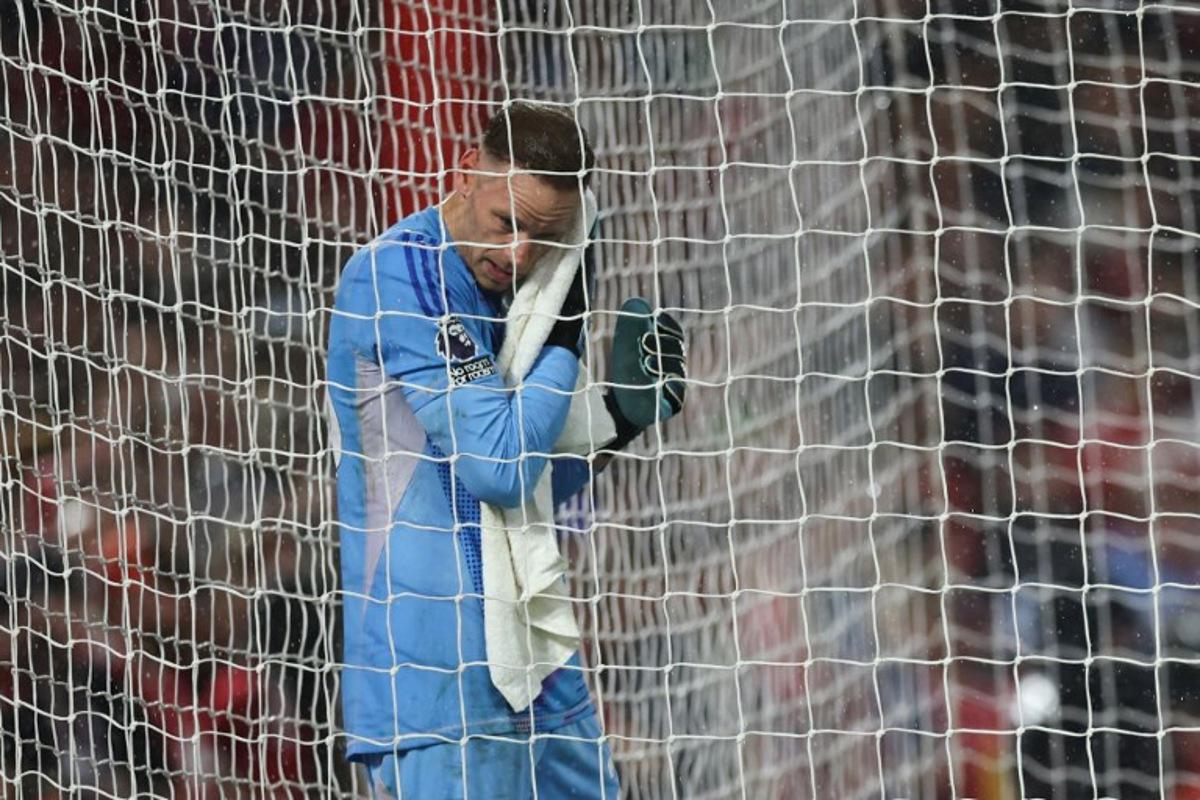 Nottingham Forest's Belgian goalkeeper #26 Matz Sels wips the rain from his face during the English Premier League football match between Nottingham Forest and Brentford at The City Ground in Nottingham, central England, on May 1, 2025. Darren Staples / AFP