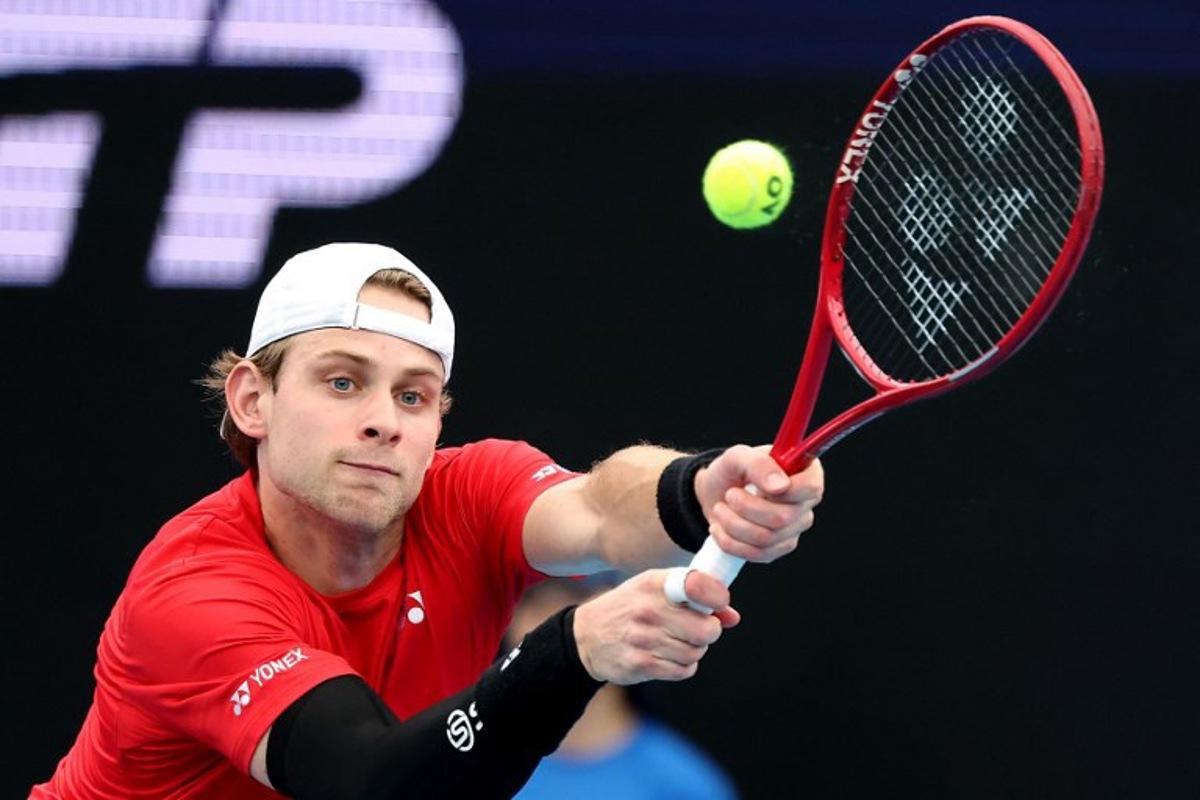 Belgium's Zizou Bergs hits a return to China's Zhang Zhizhen during their men's singles match at the United Cup tennis tournament on Ken Rosewall Arena in Sydney on January 3, 2026. DAVID GRAY / AFP