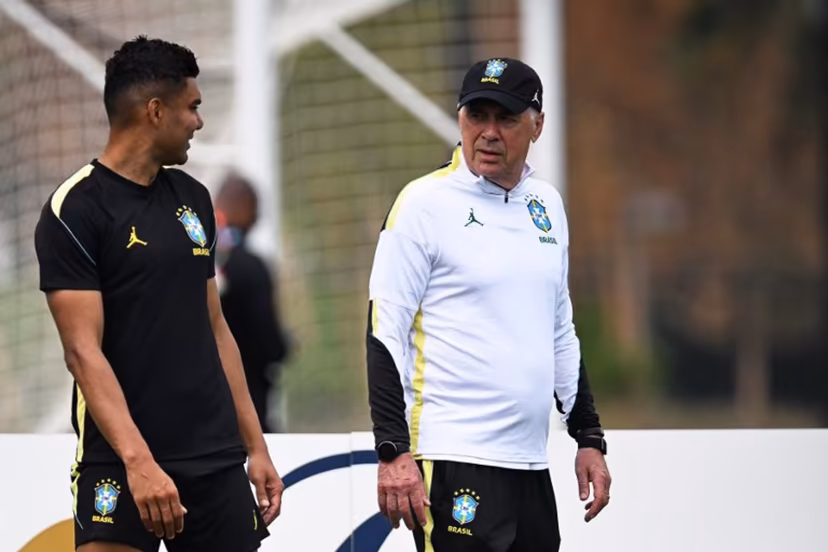 Brazil's Italian head coach Carlo Ancelotti (R) and Brazil's midfielder #05 Casemiro take part in an MD-1 training session at Columbia Park Training Facility in Morristown, New jersey, on June 18, 2026, on the eve of the World Cup 2026 Group C football match between Brazil and Haiti. MAURO PIMENTEL / AFP