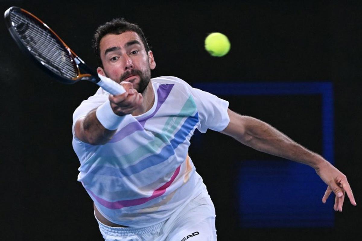 Croatia's Marin Cilic hits a shot against Norway's Casper Ruud during their men's singles match on day seven of the Australian Open tennis tournament in Melbourne on January 24, 2026. WILLIAM WEST / AFP