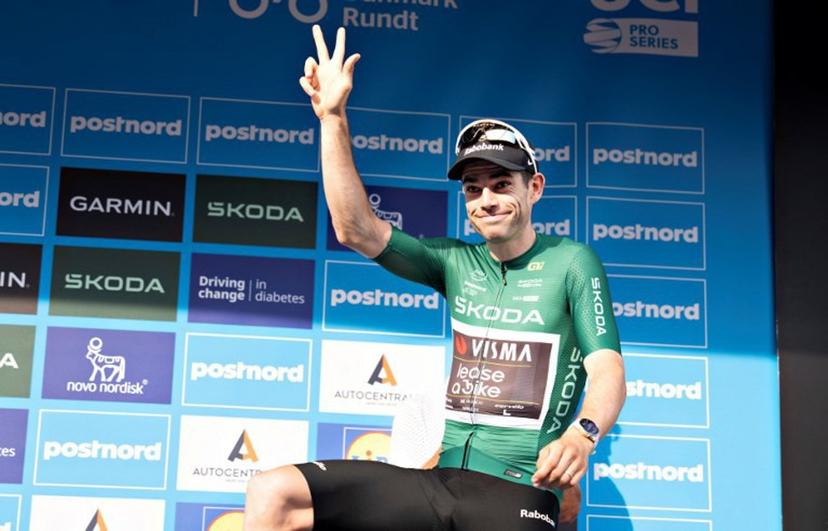 Team Visma | Lease a Bike's Belgian rider Wout Van Aert celebrates after being declared the winner of the 2. stage on the photo finish and wears green points jersey of the PostNord Denmark Tour on July 30, 2026 in Skive, Denmark. The stage 2 is 187.2 kilometers long and runs from Glyngoere to Skive. Henning Bagger / Ritzau Scanpix / AFP