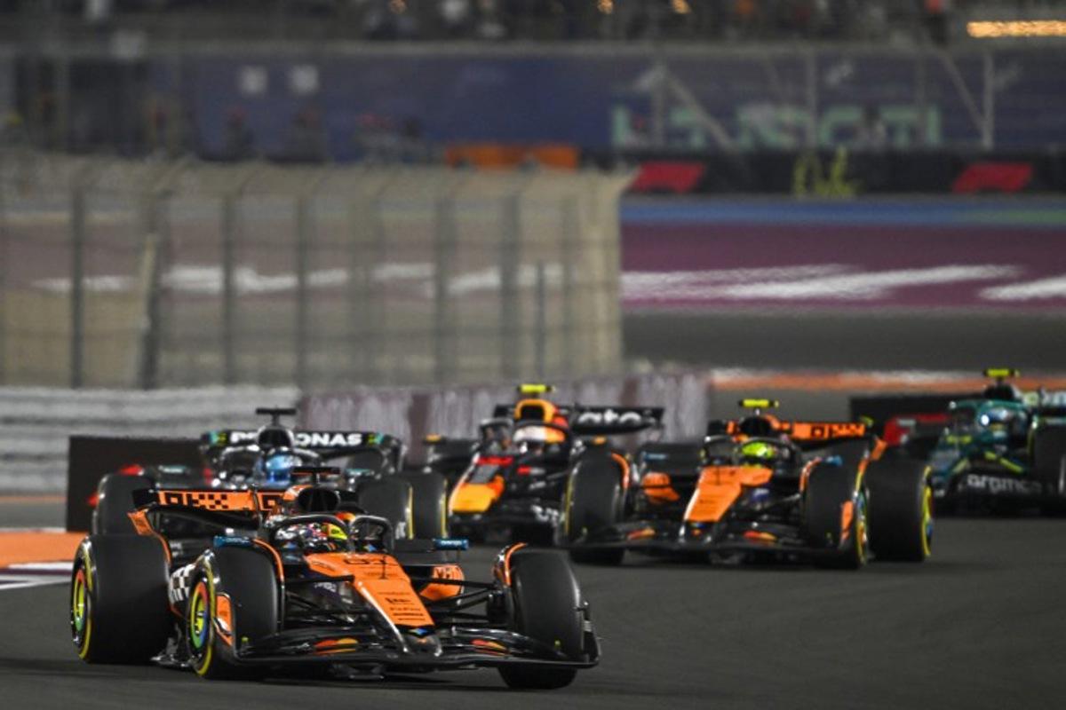 McLaren's Australian driver Oscar Piastri leads the pack during sprint race ahead of the Formula One Qatar Grand Prix at the Lusail International Circuit in Lusail on November 29, 2025. Mahmud HAMS / AFP