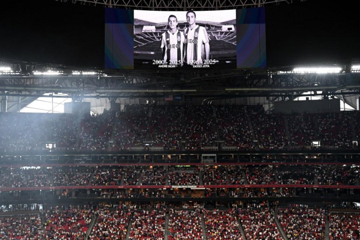 View of a screen with the image of Liverpool's Portuguese forward Diogo Jota and his brother Andre Silva, who passed away after a car crash, during a minute of silence in their honor ahead of the FIFA Club World Cup 2025 quarterfinal football match between France's Paris Saint-Germain and Germany's Bayern Munich at the Mercedes-Benz Stadium in Atlanta on July 5, 2025. Roberto SCHMIDT / AFP