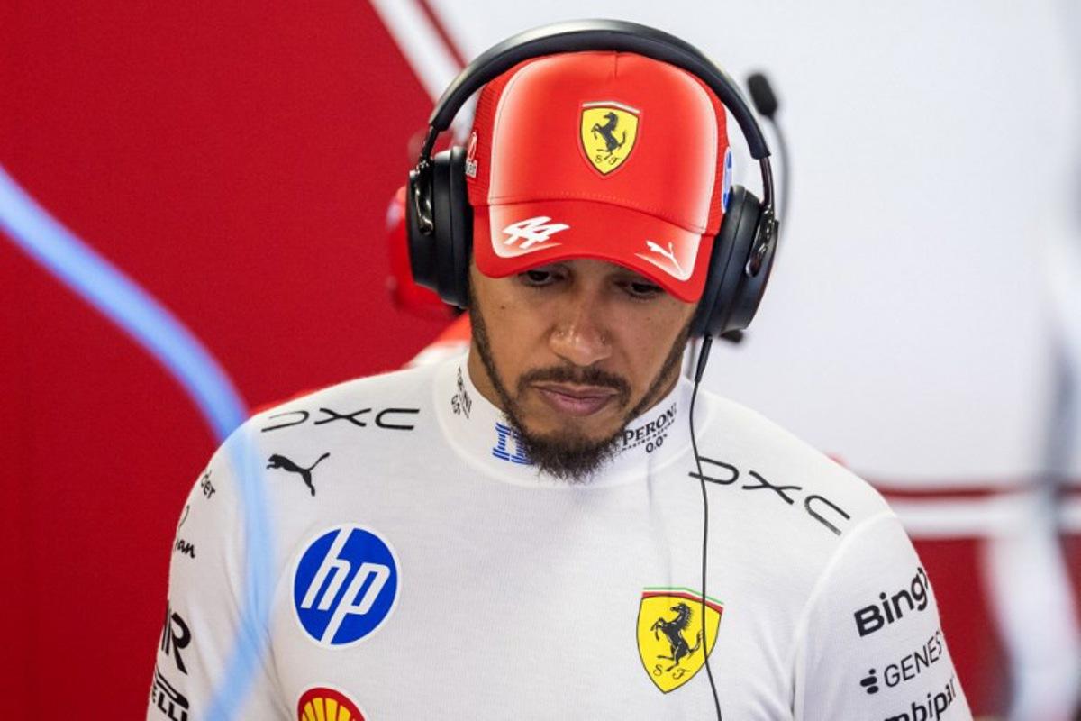 Ferrari's British driver Lewis Hamilton inspects his car during the first practice session at the Hungaroring racetrack in Mogyorod near Budapest, Hungary, on July 24, 2026 ahead of the Formula One Hungarian Grand Prix. Andrej ISAKOVIC / AFP