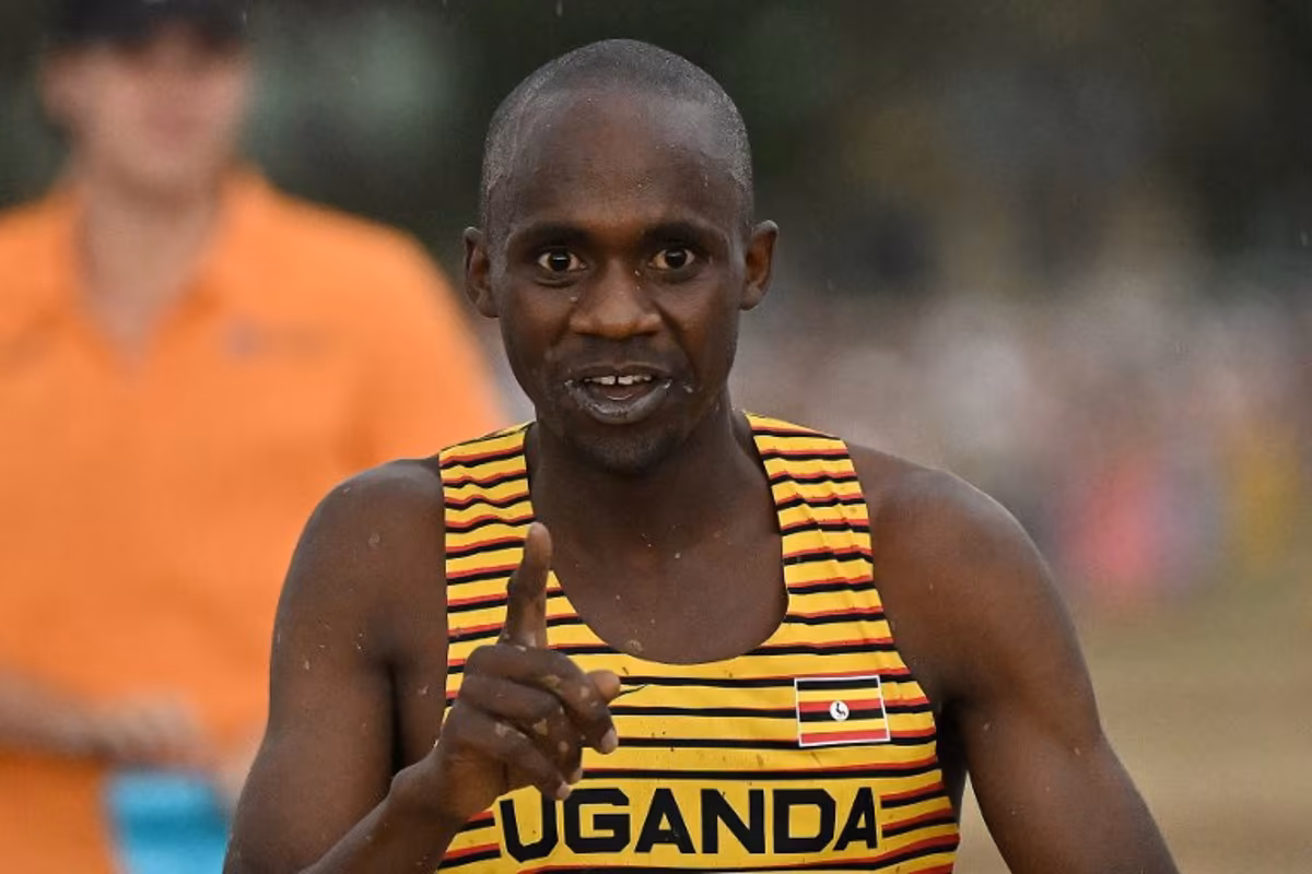 Uganda's Jacob Kiplimo celebrates after crossing the finish line to win the men's senior race during the 2023 World Cross Country Championships at Mount Panorama in Bathurst on February 18, 2023. Saeed KHAN / AFP