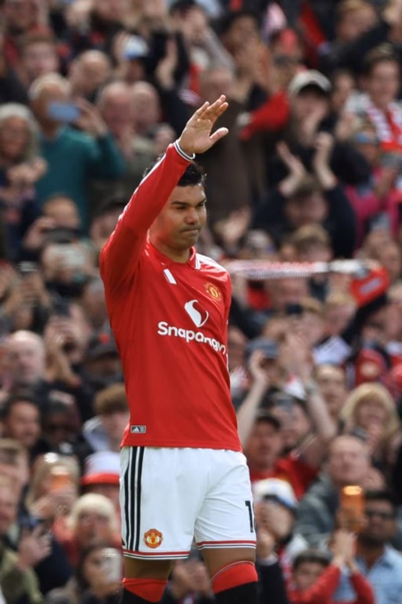 Manchester United's Brazilian midfielder #18 Casemiro gestures to supporters as he leaves the game sunstituted on his final home appearance during the English Premier League football match between Manchester United and Nottingham Forest at Old Trafford in Manchester, north west England, on May 17, 2026. Darren Staples / AFP