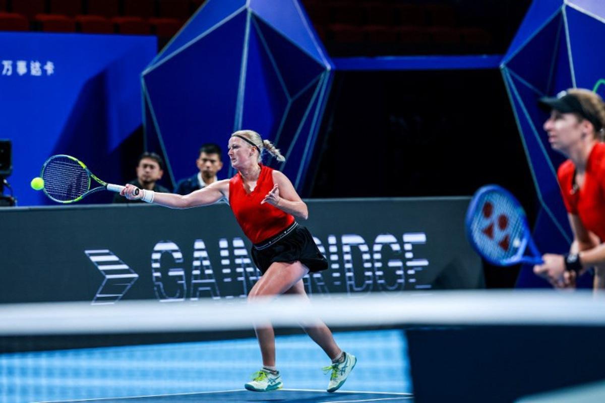 Belgium's Lara Salden (L) hits a return next to Magali Kempen (R) as they play against Ukraine's Anhelina Kalinina and Lyudmyla Kichenok during their women's doubles quarter-final match at the Billie Jean King Cup tennis tournament in Shenzhen, southern China's Guangdong province on September 24, 2026. CN-STR / AFP