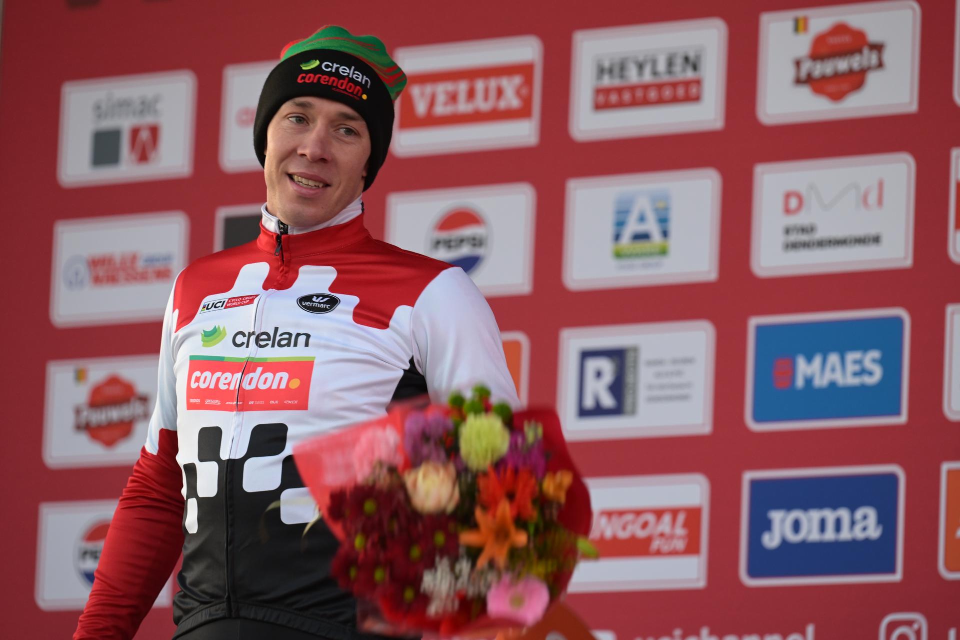 Third Belgian Laurens Sweeck celebrates on the podium after the men's elite race at the World Cup cyclocross cycling event in Dendermonde, Belgium, stage 8 (out of 12) of the UCI World Cup cyclocross competition, Sunday 28 December 2025. BELGA PHOTO DAVID PINTENS