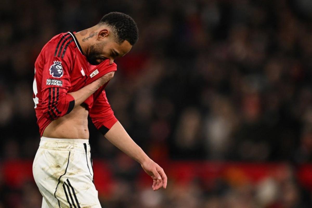 Manchester United's Brazilian striker #10 Matheus Cunha reacts during the English Premier League football match between Manchester United and Bournemouth at Old Trafford in Manchester, north west England, on December 15, 2025. PETER POWELL / AFP