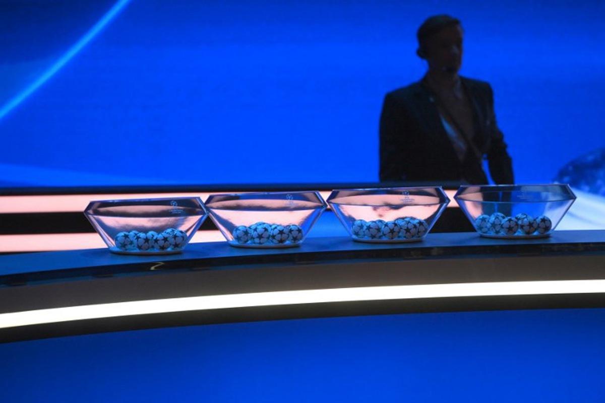 This photograph shows draw balls displayed on set prior to the draw ceremony for the UEFA Champions League football tournament 2023-2024 at The Grimaldi Forum in the Principality of Monaco on August 31, 2023. NICOLAS TUCAT / AFP