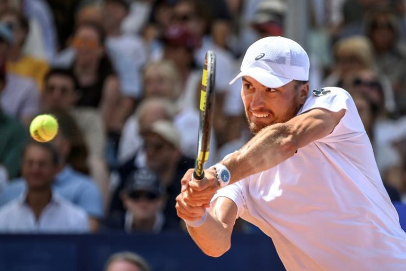 Belgium's Raphael Collignon returns the ball to Greece's Stefanos Tsitsipas during their men's singles final match at the Swiss Open tennis tournament in Gstaad, on July 19, 2026. Fabrice COFFRINI / AFP