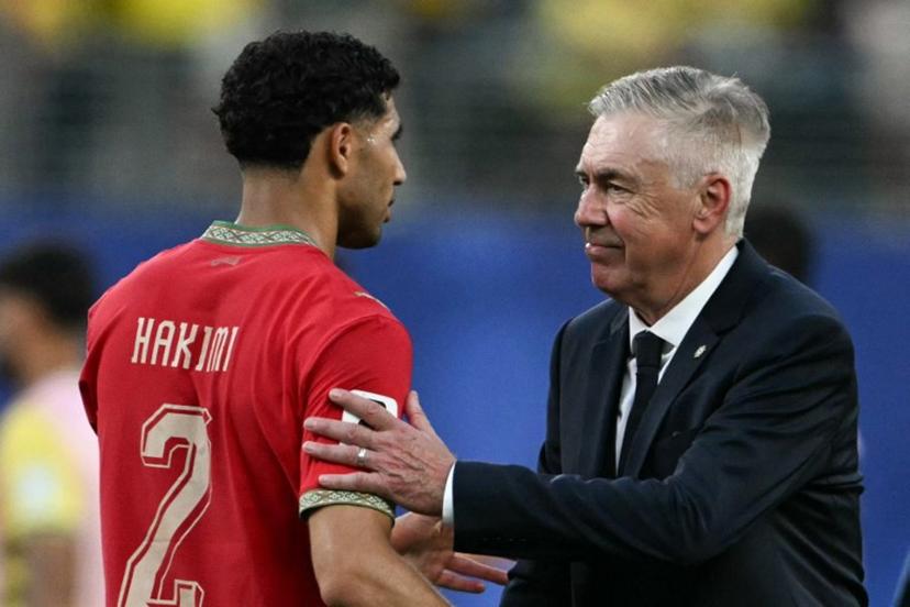 Brazil's Italian head coach Carlo Ancelotti greets Morocco's defender #02 Achraf Hakimi at the end of the 2026 World Cup Group C football match between Brazil and Morocco at the New York/New Jersey Stadium in East Rutherford on June 13, 2026. Mauro PIMENTEL / AFP