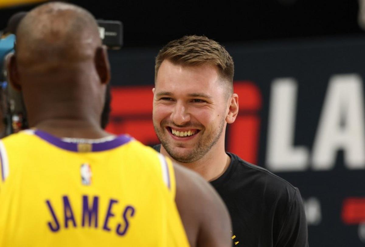 US basketball player LeBron James (L) and Slovenian basketball player Luka Doncic (R) attend the Los Angeles Lakers media day at UCLA Health Training Center El Segundo, California on September 29, 2025. Patrick T. Fallon / AFP