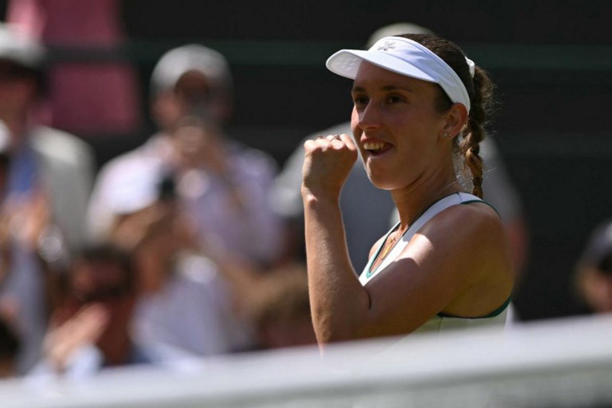 Belgium's Elise Mertens celebrates winning against Kazakhstan's Elena Rybakina during their women's singles third round tennis match on the sixth day of the 2026 Wimbledon Championships at The All England Lawn Tennis and Croquet Club in Wimbledon, southwest London, on July 4, 2026. Glyn KIRK / AFP