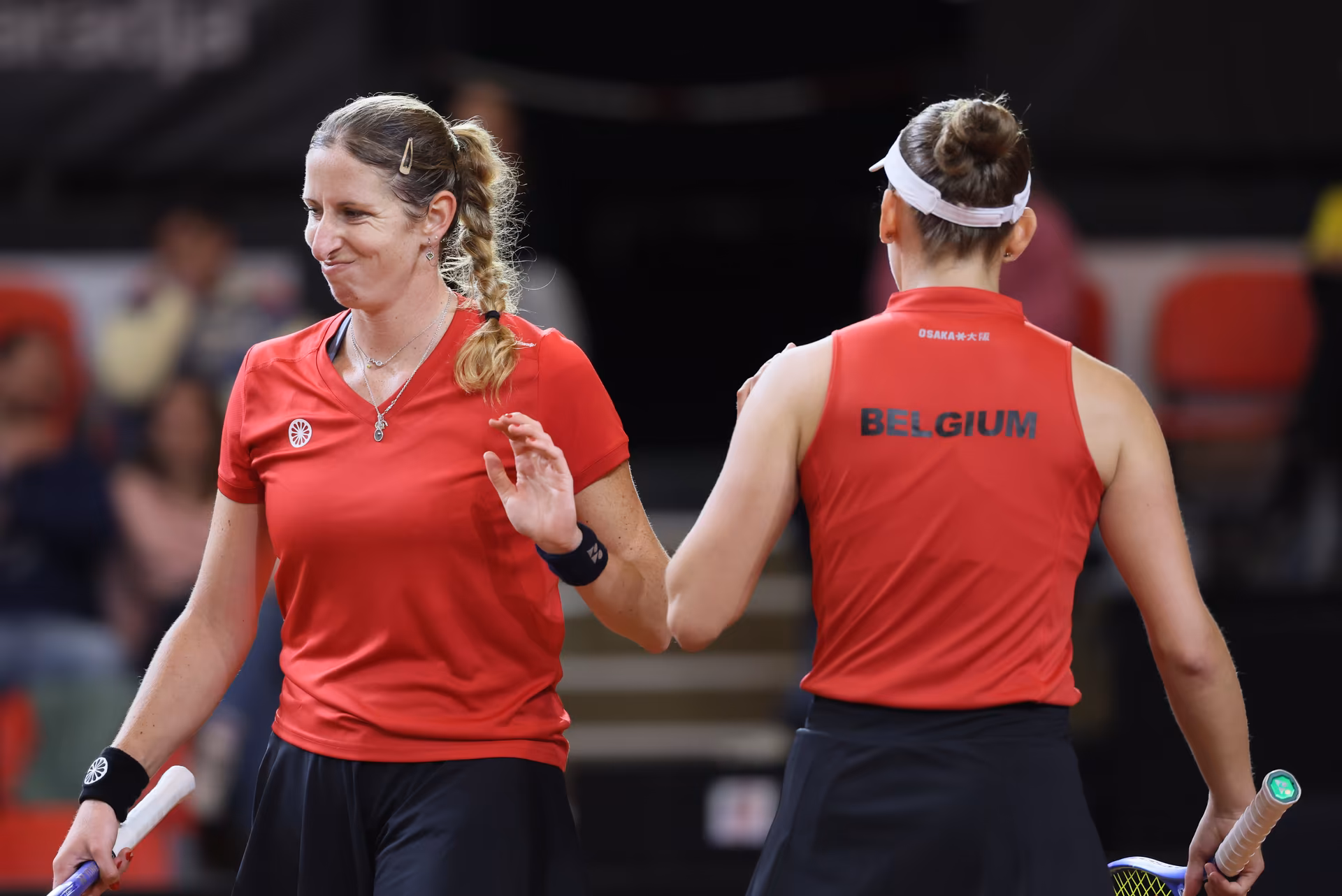 Belgian Magali Kempen and Belgian Greet Minnen pictured during the third game, a double game between Belgian pair Kempen/ Minnen and US pair McNally/ Melichar on the second day of the qualifiers of the Billie Jean King Cup tennis between Belgium and the USA, in Oostende, Belgium, on . The meeting takes place on 10 and 11th April. PHOTO BENOIT DOPPAGNE