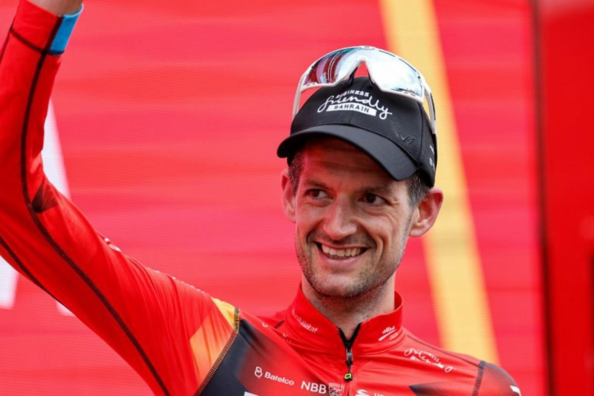 Team Bahrain's Dutch rider Wout Poels celebrate on the podium after winning the stage 20 of the 2023 La Vuelta cycling tour of Spain, a 207,8 km race between Manzanares el Real and Guadarrama, on September 16, 2023. Oscar DEL POZO / AFP