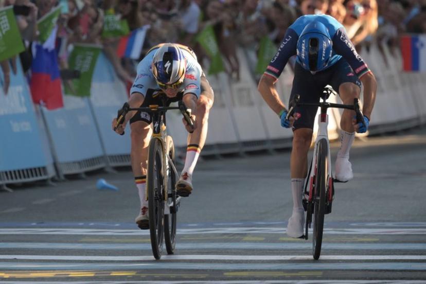 Belgium's rider Remco Evenepoel (L) crosses the finish line to win ahead of Italy's rider Giulio Ciccone the men's elite road race of the UEC European Road Cycling Championships in Sencur, near Ljubljana, Slovenia, on October 4, 2026. JURE MAKOVEC / AFP