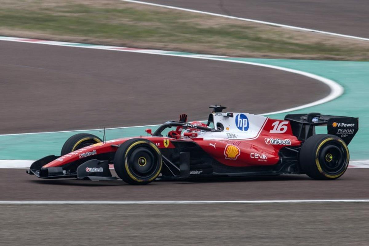 Monaco's Charles Leclerc (16) waves to fans while he steers the new Formula 1 Ferrari SF-26 during tests at the Fiorano Circuit in Fiorano Modenese, on January 23, 2026. Federico SCOPPA / AFP