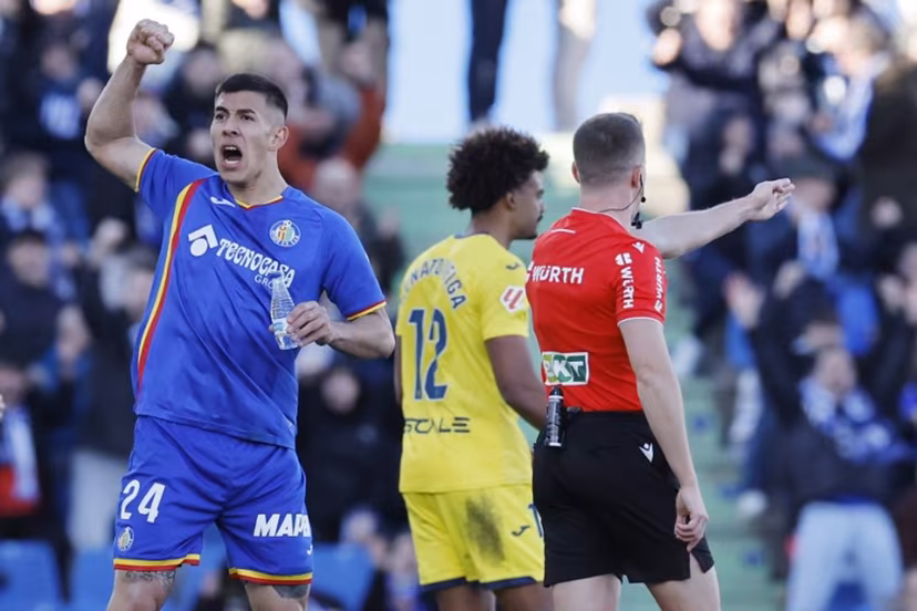 Getafe's Argentine defender #24 Zaid Romero Player celebrates as referee awards penalty against Villarrea during the Spanish league football match between Getafe CF and Villarreal CF at Coliseum Alfonso Perez Stadium in Getafe on February 14, 2026. Oscar DEL POZO / AFP