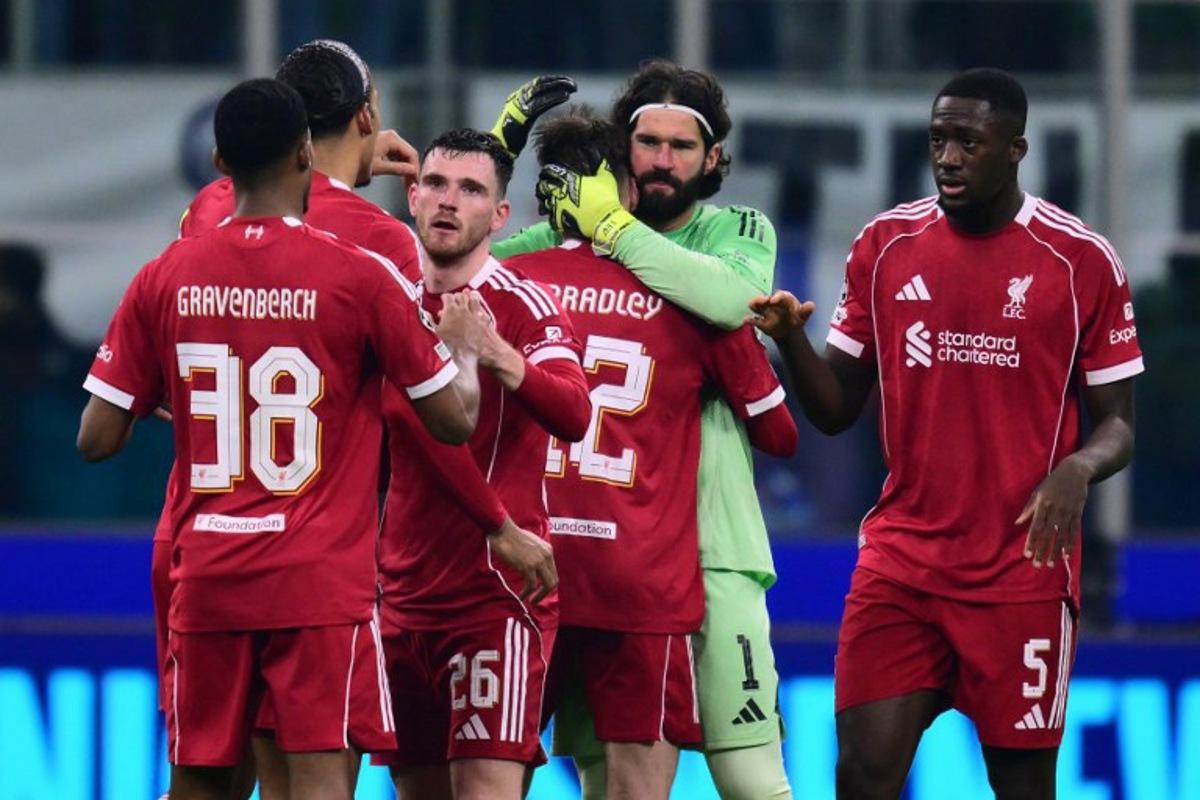 Liverpools players celebrate after winning the UEFA Champions League phase day 6 football match between Inter Milan and Liverpool at San Siro stadium in Milan, on December 9, 2025. Stefano RELLANDINI / AFP