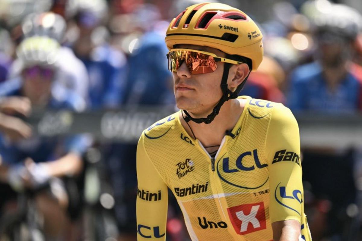 Uno-X Mobility team's Norwegian rider Torstein Traeen wearing the overall leader's yellow jersey awaits the start of the 6th stage of the 113th edition of the Tour de France cycling race, 186 km between Pau and Gavarnie-Gèdre in the French Pyrenees, on July 9, 2026. Jeff PACHOUD / AFP