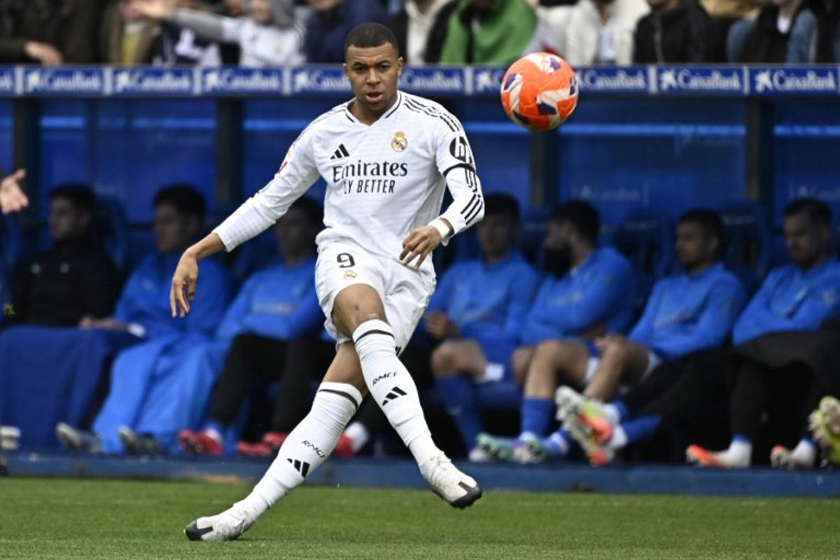 Real Madrid's French forward #09 Kylian Mbappe kicks the ball during the Spanish league football match between Deportivo Alaves and Real Madrid CF at the Mendizorroza stadium in Vitoria on April 13, 2025. ANDER GILLENEA / AFP
