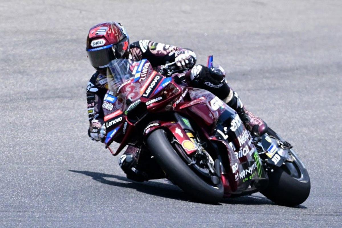 Ducati Lenovoi Team's Spanish MotoGP rider Marc Marquez steers his motorbike during the Italian Moto GP Grand Prix at Mugello circuit, in Mugello, near Florence, on June 22, 2025. Tiziana FABI / AFP